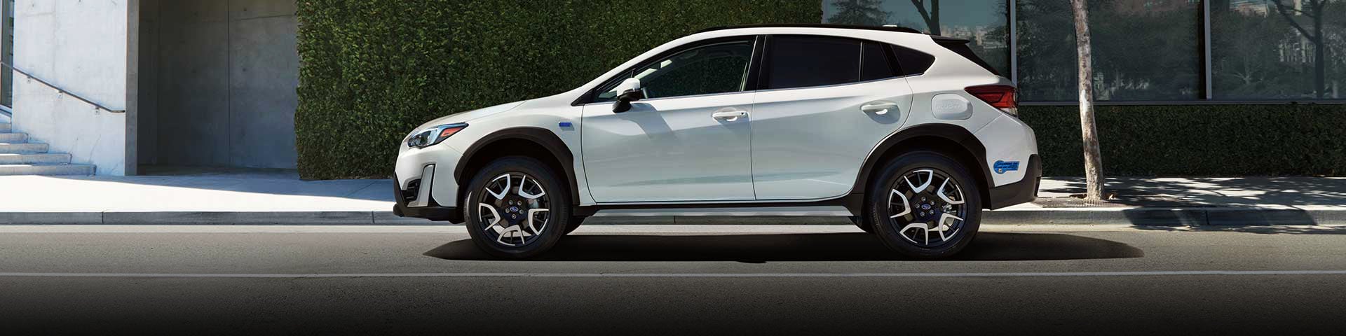 The side profile of a white Subaru Crosstrek Hybrid | Subaru of Ann Arbor in Ann Arbor MI