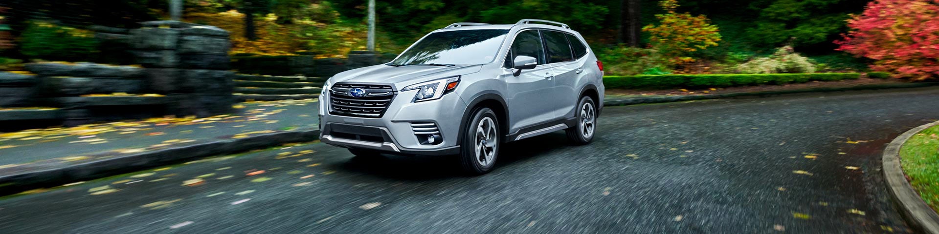 A 2022 Forester driving on a highway. | Subaru of Ann Arbor in Ann Arbor MI