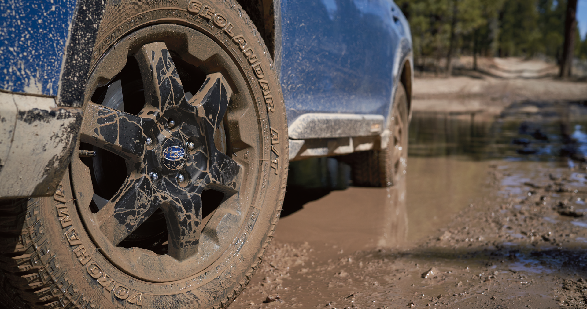 A close-up of the 17-inch off-road wheels and all-terrain Yokohama GEOLANDAR® tires on the 2023 Outback Wilderness. | Subaru of Ann Arbor in Ann Arbor MI
